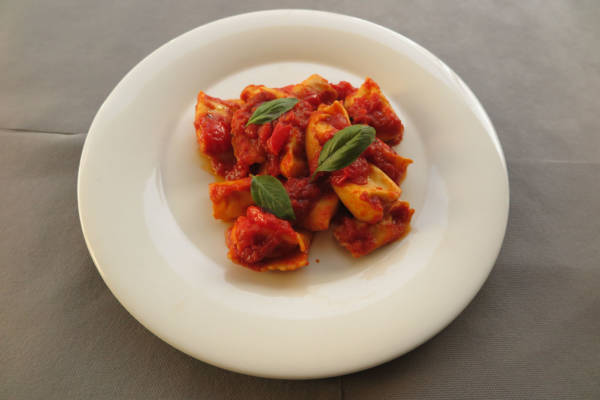 Handmade Ravioli stuffed with Ricotta, Tomato Cherry and Basil Sauce