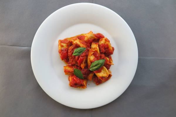 Handmade Ravioli stuffed with Ricotta, Tomato Cherry and Basil Sauce