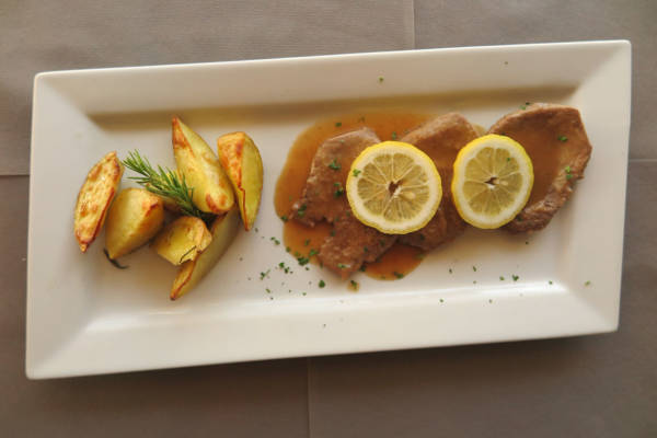 Veal Steak with Lemon Sauce, Fries and Salad