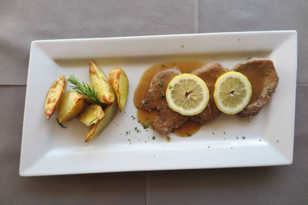 Veal Steak with Lemon Sauce, Fries and Salad