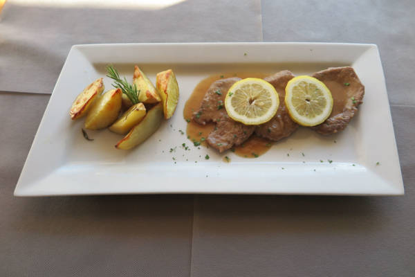 Veal Steak with Lemon Sauce, Fries and Salad