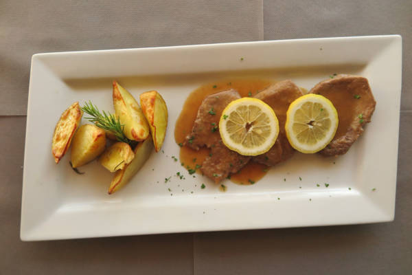 Veal Steak with Lemon Sauce, Fries and Salad